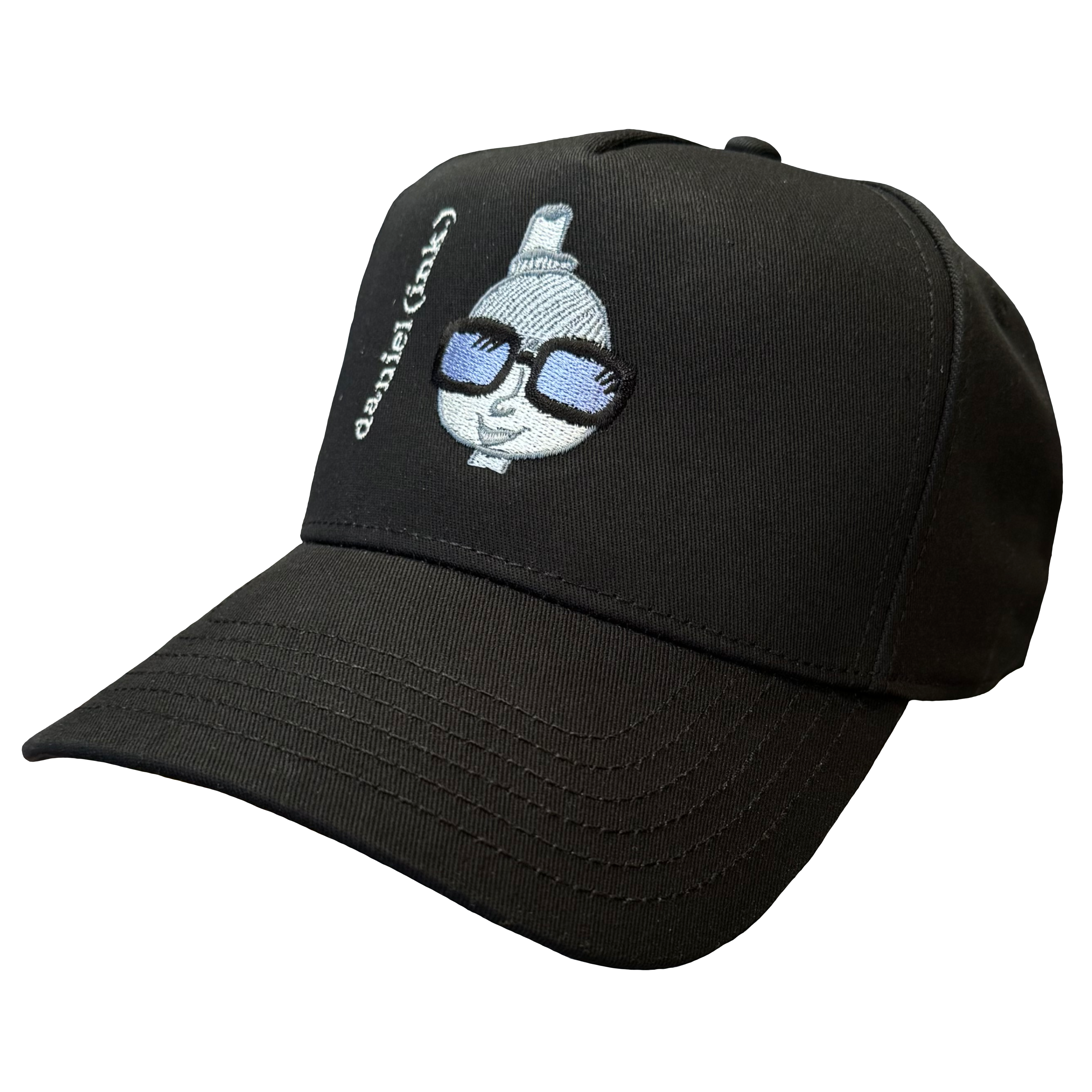 Black snapback cap featuring an embroidered image of a person's head in silver. The person is wearing a small top hat and big sunglasses with black frames and blue lenses. The name daniel(ink.) is embroidered in silver thread next to the person's head.