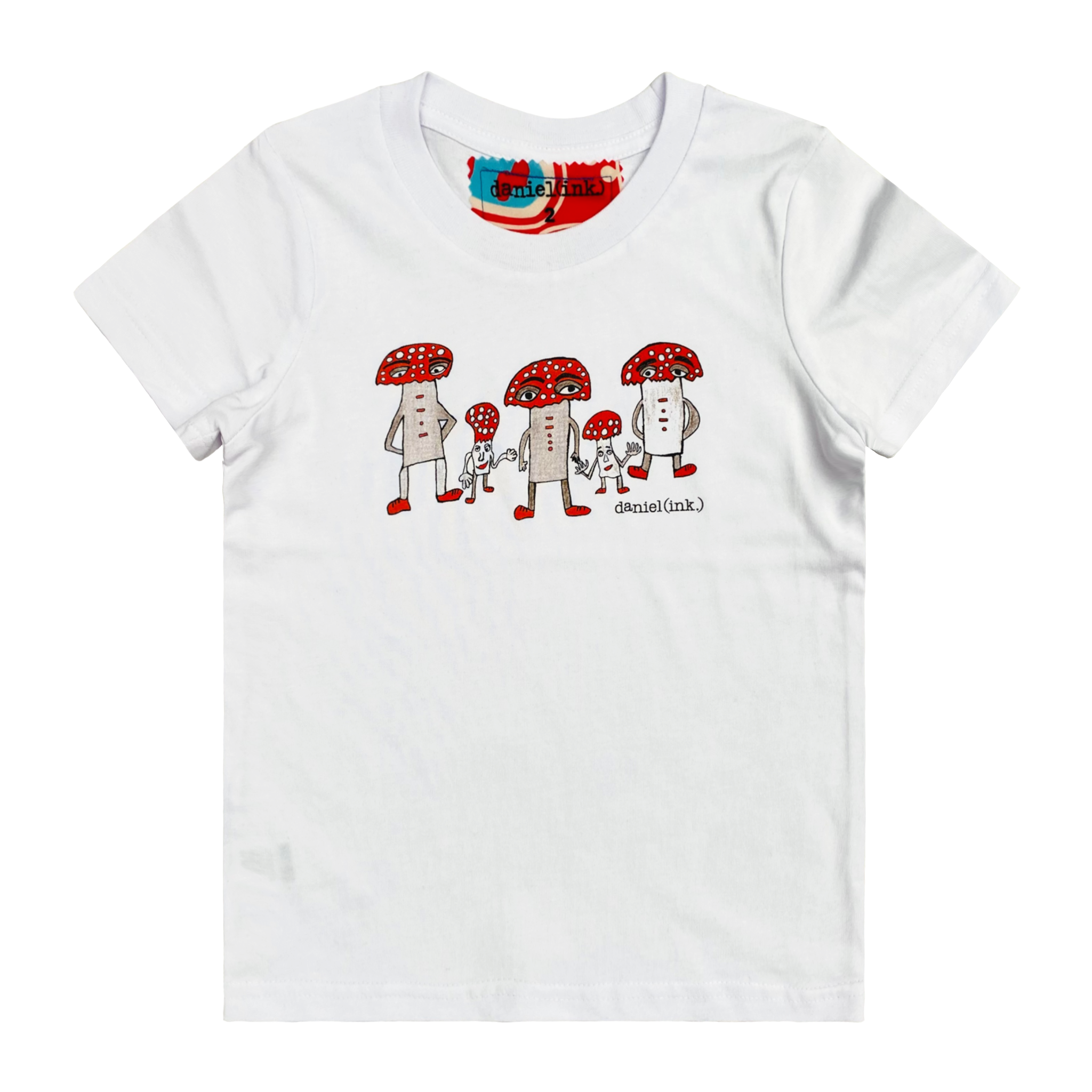 White kids' t-shirt featuring a hand drawn image of five humanoid mushroom figures, three large and two small, standing next to each other. Each mushroom figure has a red mushroom cap, red shoes, and red accents. The three large mushrooms also have red buttons on their chests which spell "magic" in Morse code. This t-shirt has a red, white, and blue fabric label on the back of the neck.