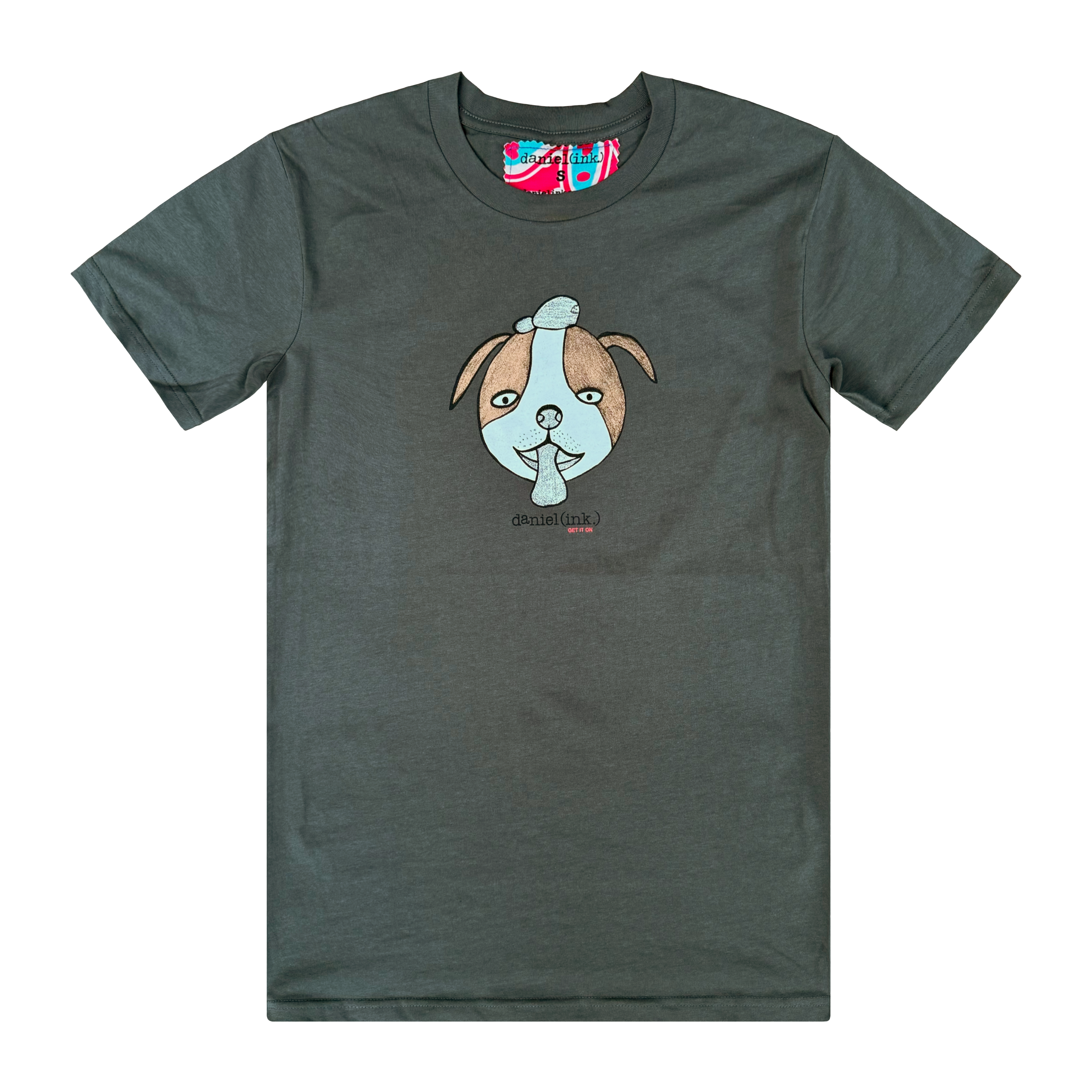 Men's charcoal colour t-shirt featuring a hand drawn sketch of a dog’s face in brown and white. The dog has a round head, floppy ears, wide eyes, and its tongue is sticking out. The t-shirt has a red, white, and blue fabric label on the back of the neck.