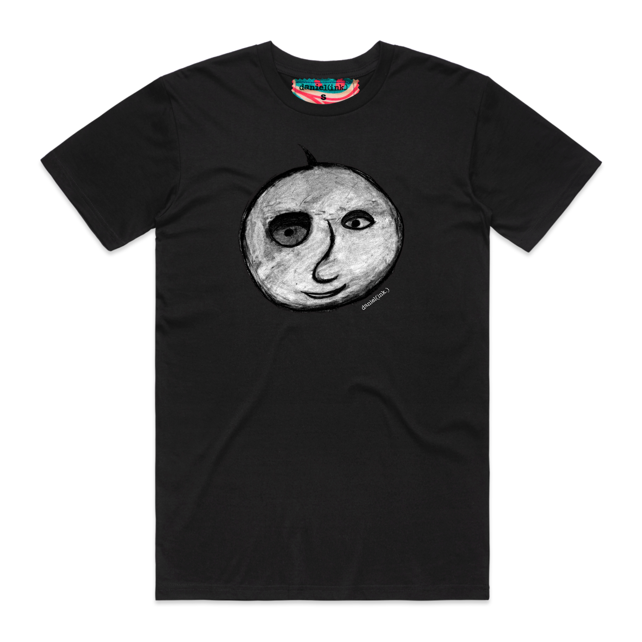 Black short sleeve men's t-shirt featuring a hand drawn charcoal sketch of an apple with a face in black and white. The t-shirt has a red, white, and blue fabric label on the back of the neck.