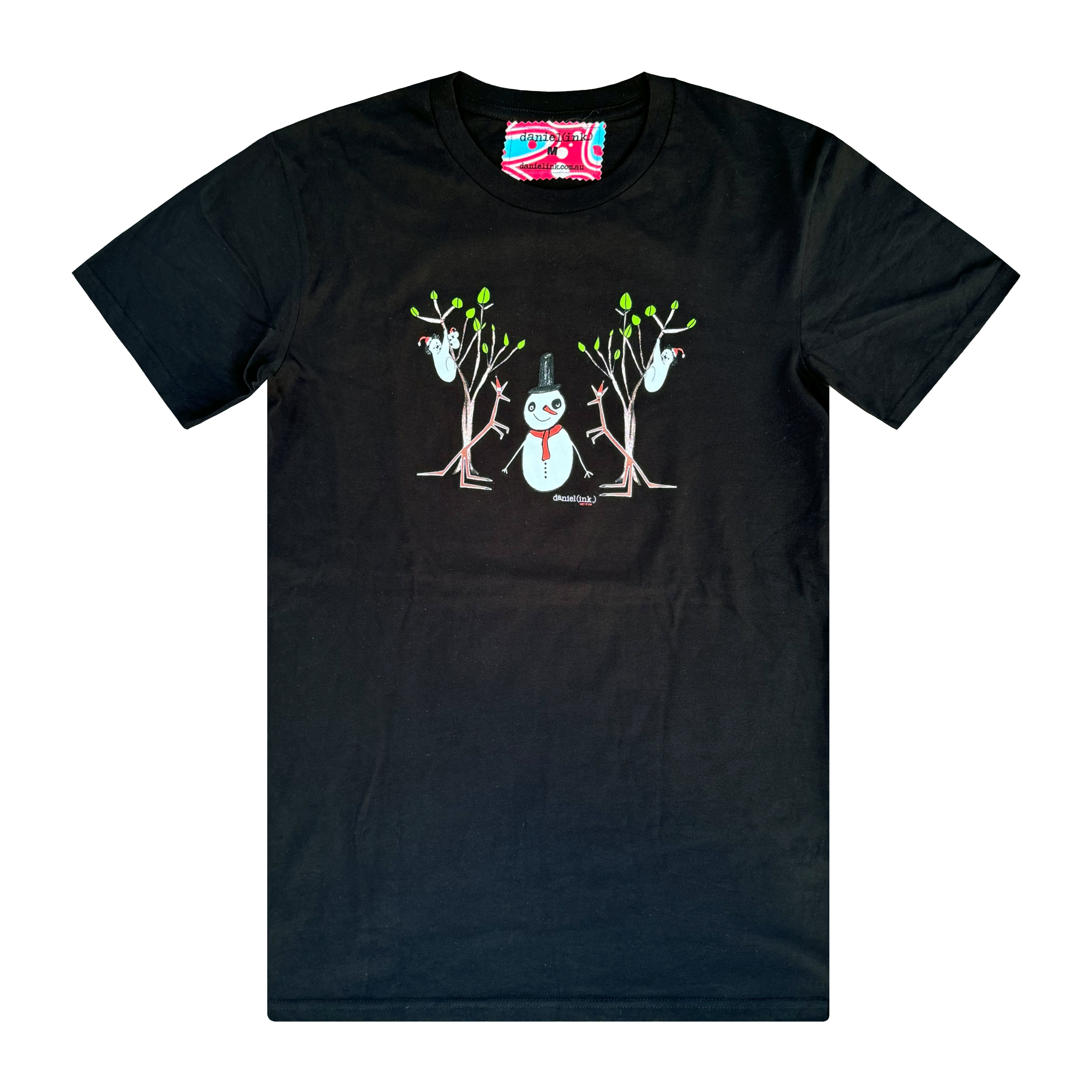 Men's black t-shirt featuring a hand drawn image of a snowman standing in between two kangaroos and in front of two large gum trees. The snowman is wearing an orange scarf and black top hat and the kangaroos are both wearing pointy Santa hats. The gum trees both have koalas wearing Santa hats in them. This t-shirt has a red, white, and blue fabric label on the back of the neck.