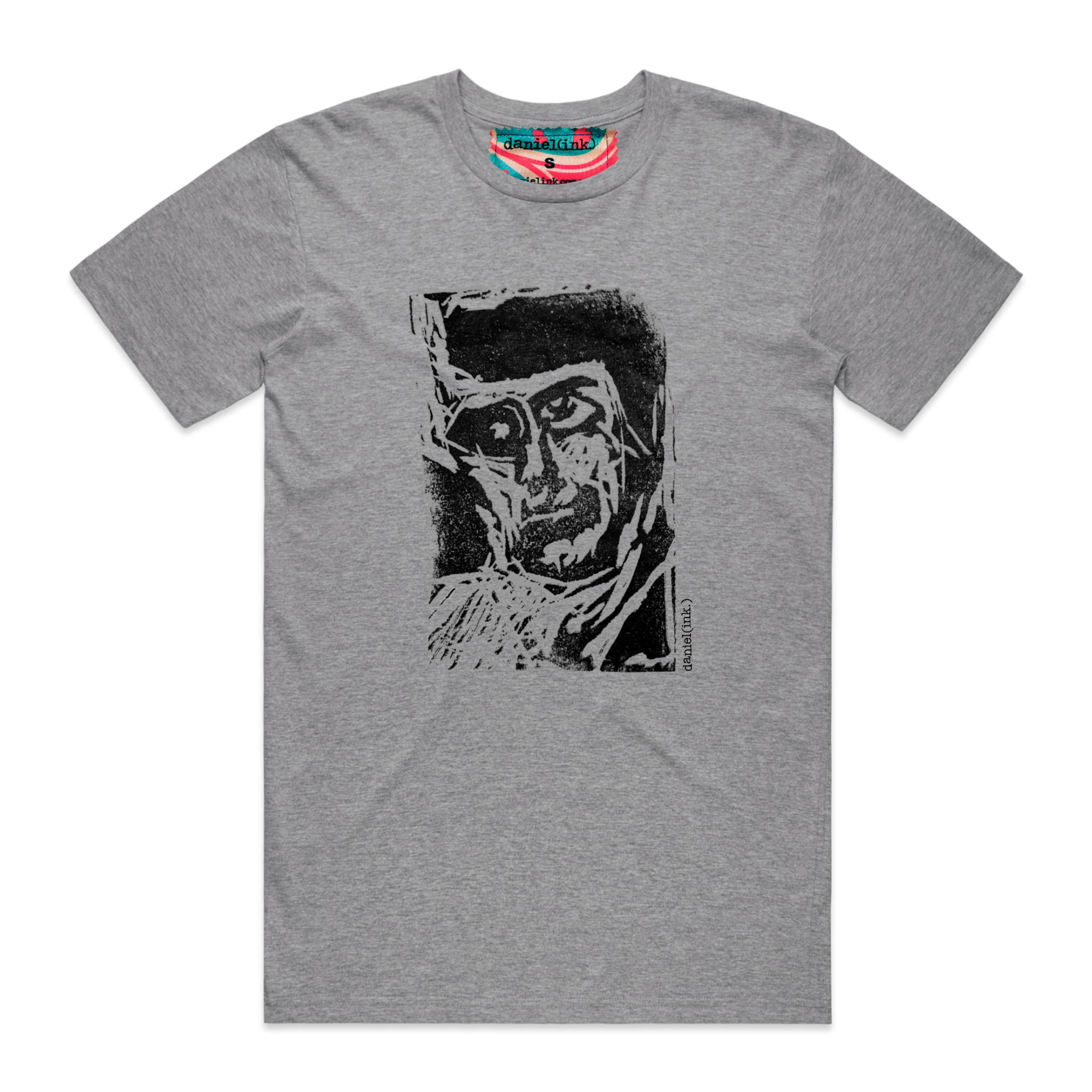 Men's grey t-shirt featuring a hand drawn sketch of an abstract face in black. This t-shirt has a red, white, and blue fabric label on the back of the neck.