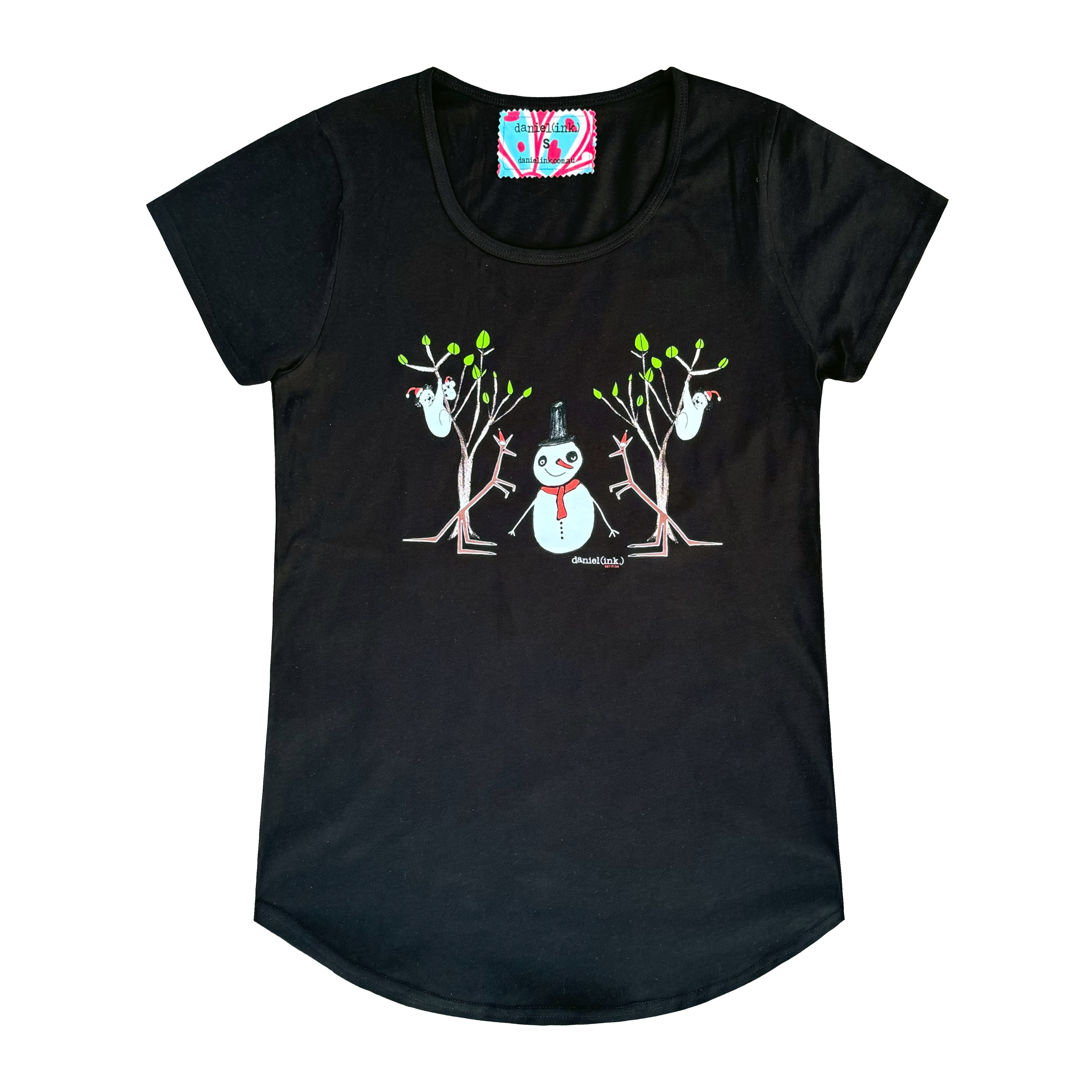 Women's black t-shirt featuring a hand drawn image of a snowman standing in between two kangaroos and in front of two large gum trees. The snowman is wearing an orange scarf and black top hat and the kangaroos are both wearing pointy Santa hats. The gum trees both have koalas wearing Santa hats in them. This t-shirt has a red, white, and blue fabric label on the back of the neck.