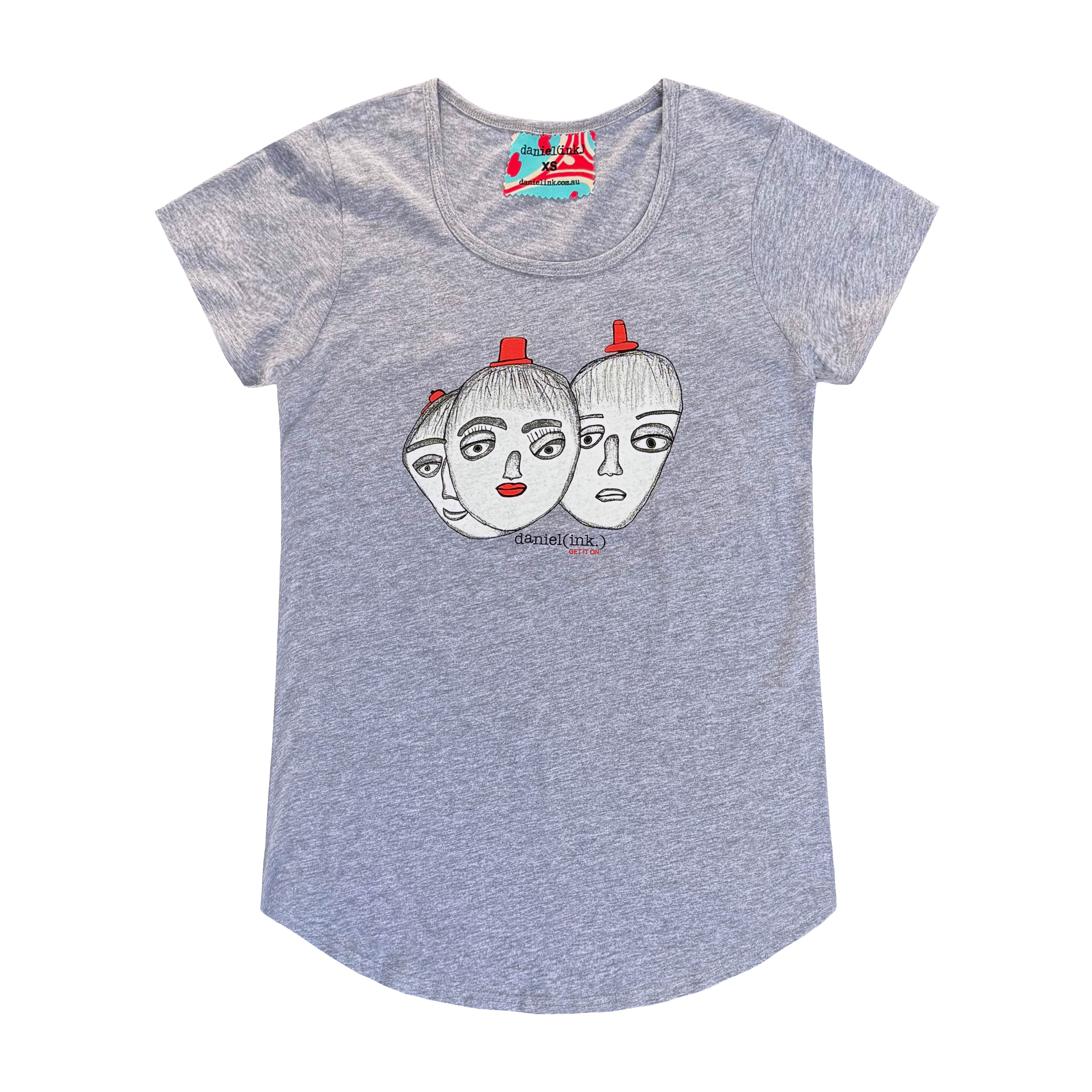 Women’s grey t-shirt featuring a hand drawn sketch of three faces merged together. The three faces have red hats and the face in the middle has red lips. This t-shirt has a red, white, and blue fabric label on the back of the neck.