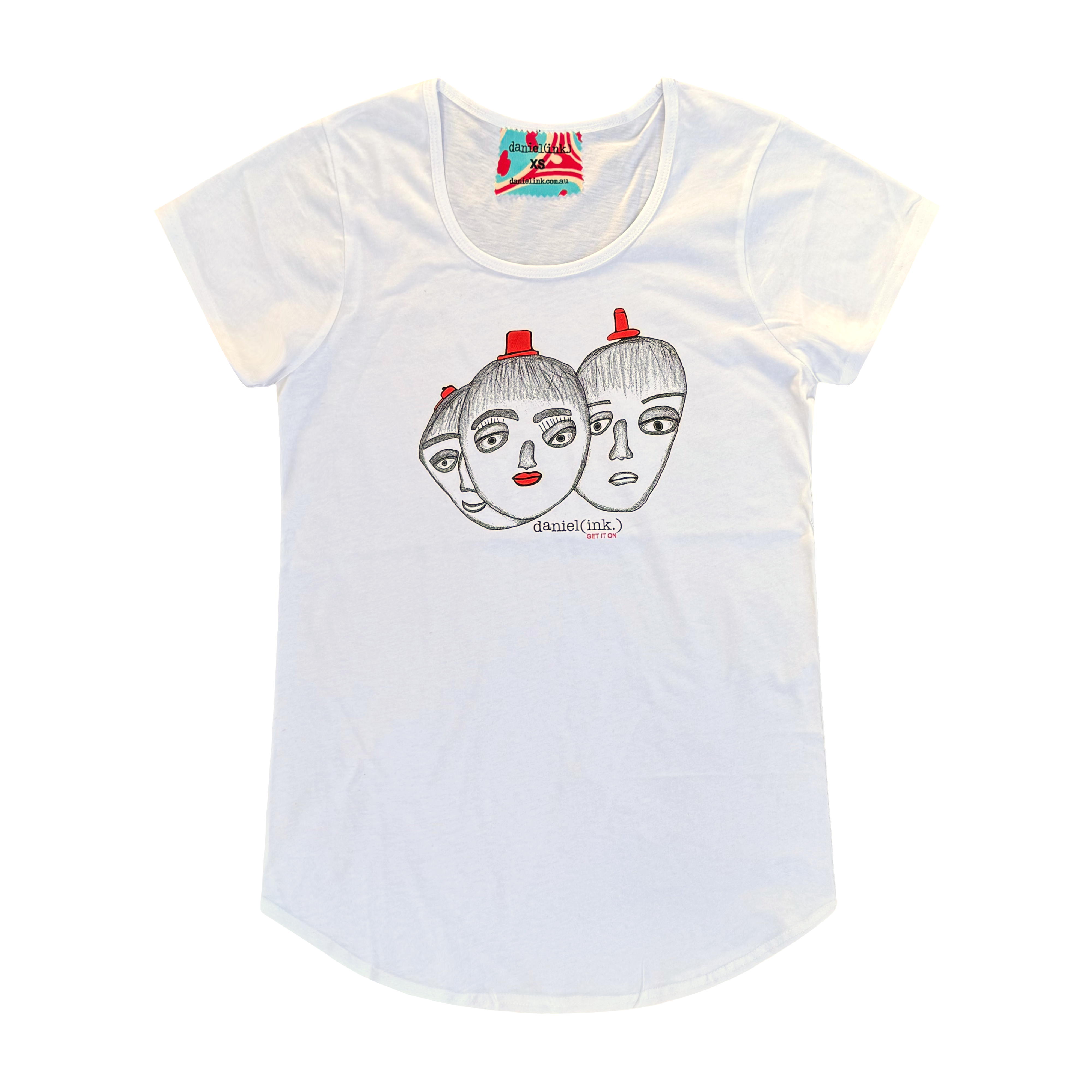 Women’s white t-shirt featuring a hand drawn sketch of three faces merged together. The three faces have red hats and the face in the middle has red lips. This t-shirt has a red, white, and blue fabric label on the back of the neck.