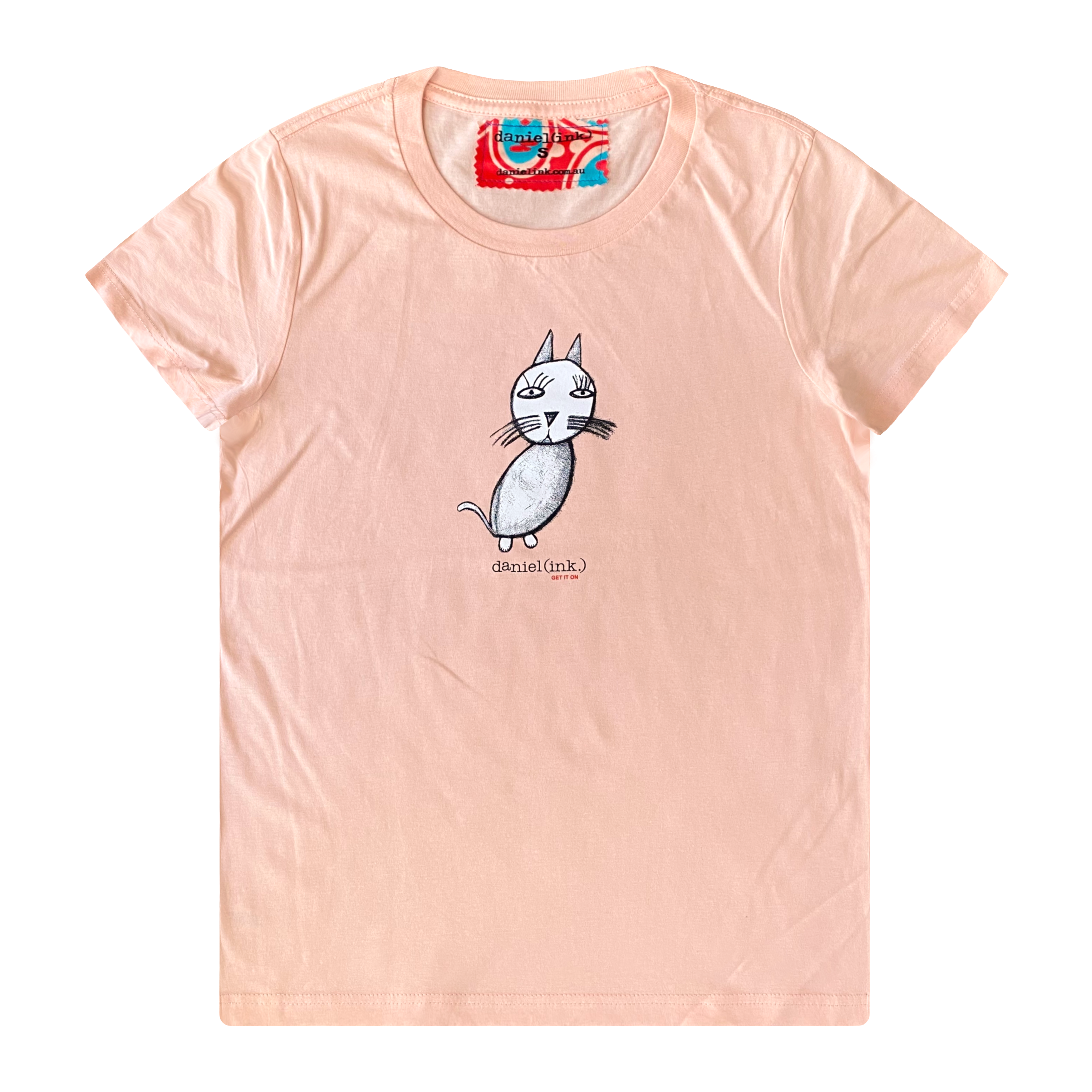 Women's pink t-shirt featuring a hand drawn sketch of a cat in white. This t-shirt has a red, white, and blue fabric label on the back of the neck.