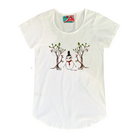 Women's white t-shirt featuring a hand drawn image of a snowman standing in between two kangaroos and in front of two large gum trees. The snowman is wearing an orange scarf and black top hat and the kangaroos are both wearing pointy Santa hats. The gum trees both have koalas wearing Santa hats in them. This t-shirt has a red, white, and blue fabric label on the back of the neck.